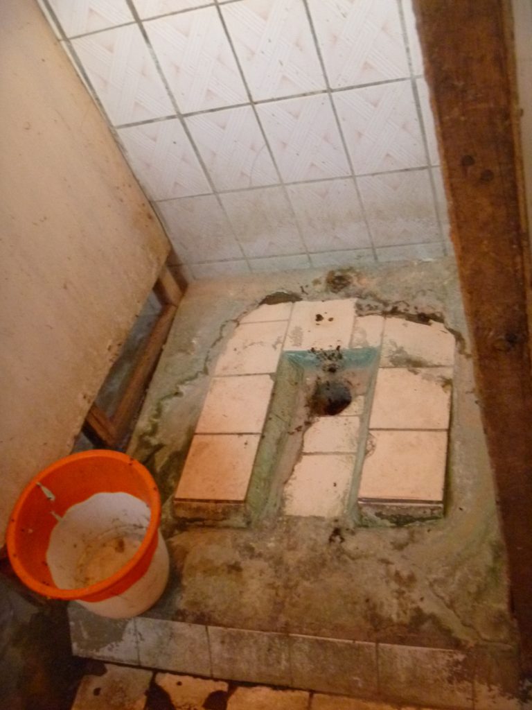 Dirty squat toilet