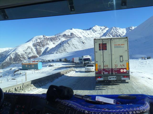 The view from the (when engines are started) cozy warm truck into the icy mountain pass