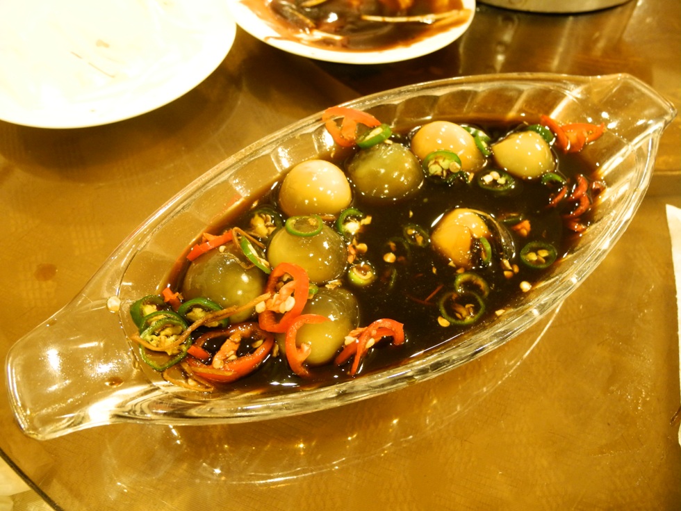 Old fermented eggs in salty sauce. These eggs have never been boiled but they are hard and delicious. We ate them in a Beijing-Duck Restaurant in Beijing, China. 